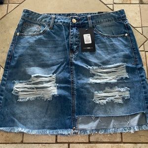 Blue jean skirt with rips
